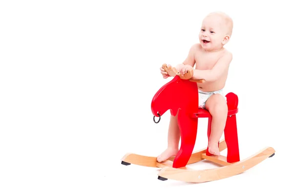 Ребенок на игрушечной лошади или лоси — стоковое фото