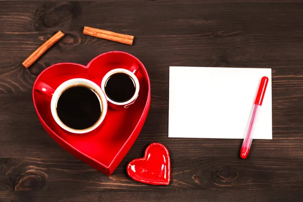 Дві чашки кави в червоному серці — стокове фото