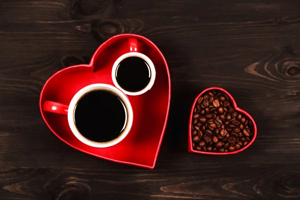 Two cups of coffee in the red heart — Stock Photo, Image