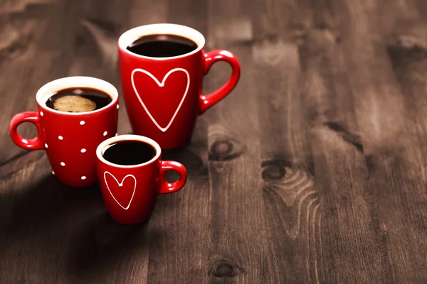 Three red coffee cups