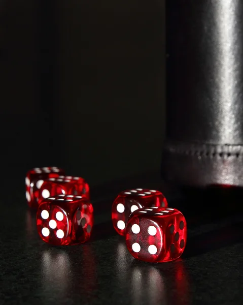 Red Dice with a Black Dice Cup — Stock Photo, Image