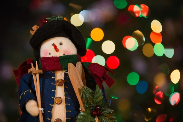 Snowman Doll with Skis and Christmas Lights — Stock Photo, Image