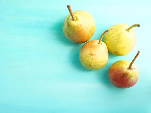 Pears on green pastel — Stock Photo, Image