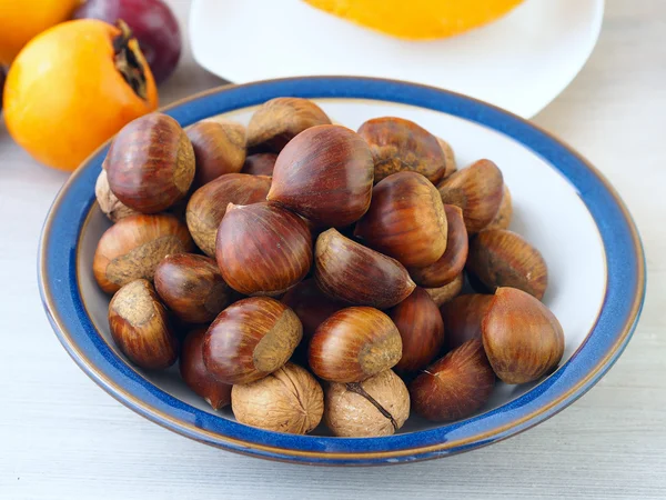 Chestnuts in a plate — Stock Photo, Image