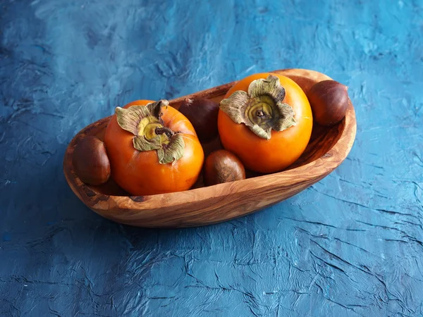 Persimmons and chestnuts — Stock Photo, Image