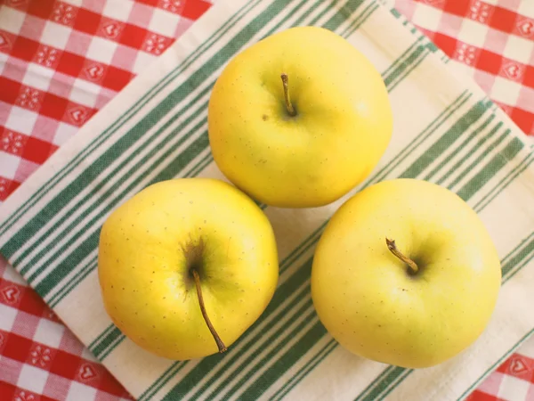 Yellow apples on napkin — Stock Photo, Image