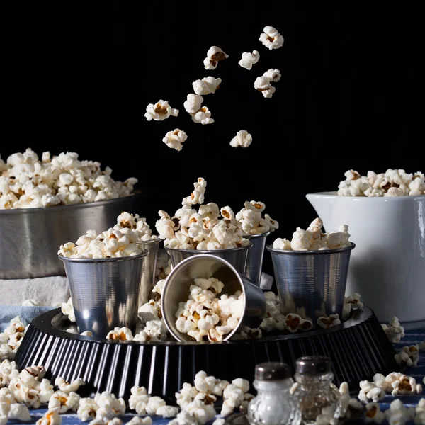 Popcorn in motion on black background