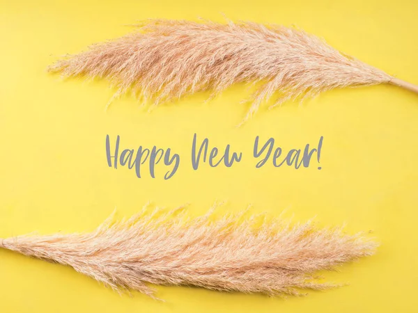 Illuminated yellow happy new year greeting card — Stock Photo, Image