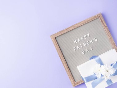 Happy fathers day greeting card with letter board and present clipart