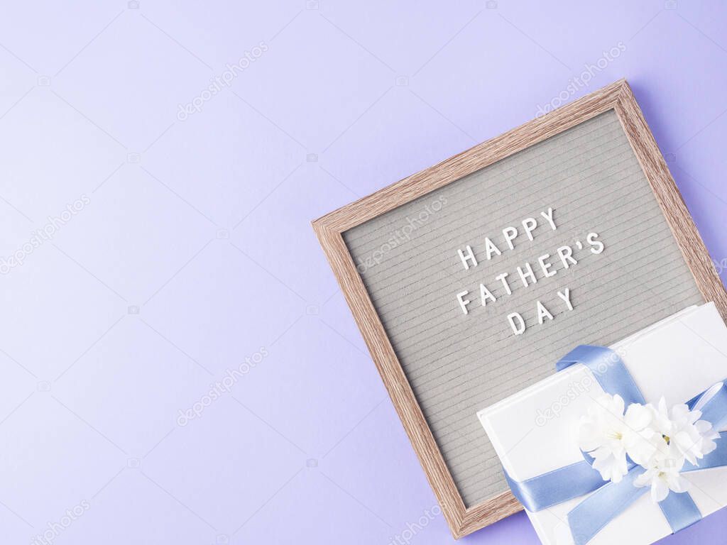 Happy fathers day greeting card with letter board and present
