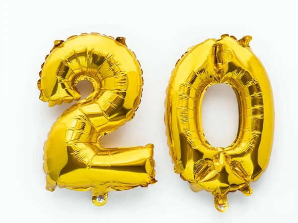 20 golden foil balloon numbers party decor on white background, birthday anniversary concept — Stock Photo, Image