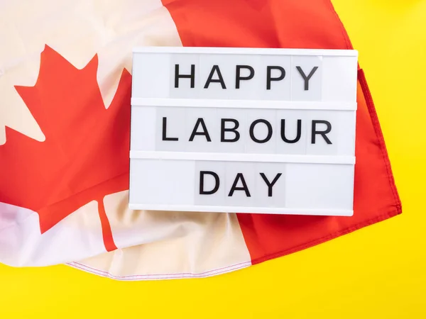 Happy Labour Day greetings on lightbox with canadian flag