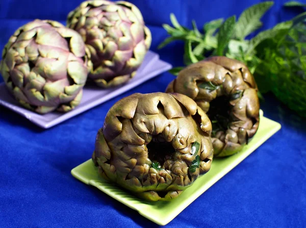 Steamed artichokes on vivid background — Stock Photo, Image