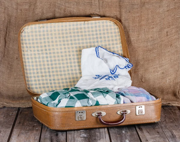 Suitcase with clothes — Stock Photo, Image