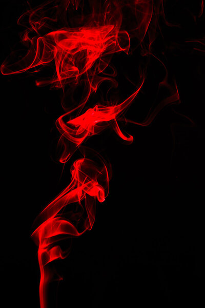 Smoke painted by green light forming an abstract figure