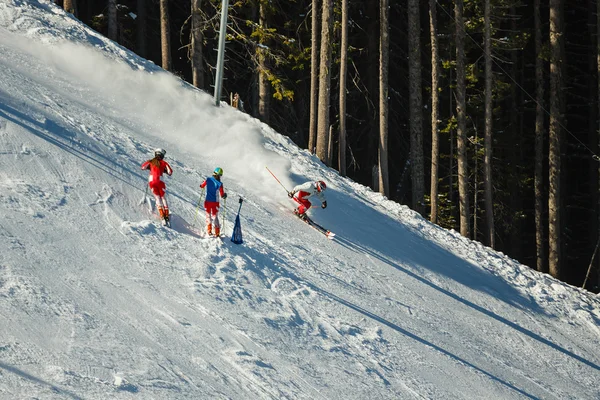 Downhill skiers on  piste — Stock Photo, Image