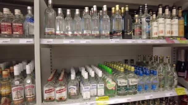 Moscow, Russia 01.15.2021 Rows of shelves with alcoholic beverages in a retail supermarket — Stock Video