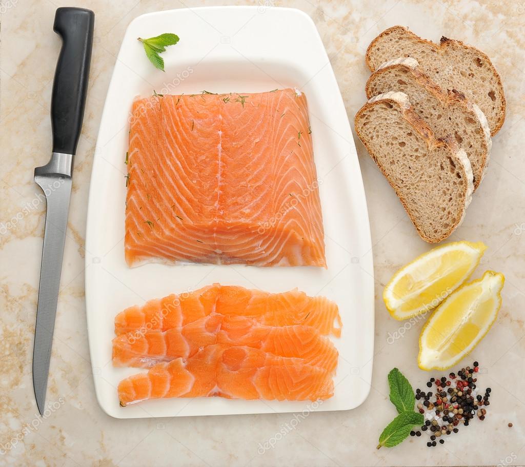 Salmon fillet cut into slices Stock Photo by ©forden 107411996