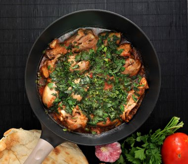 Chakhokhbili - traditional Georgian dish. Chicken stewed with he clipart