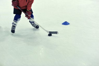 hockey player with the puck on training clipart