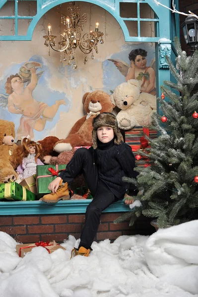 Christmas boy around Christmas tree with gifts — Stock Photo, Image