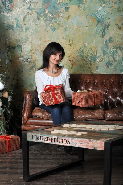 Girl with gifts at Christmas — Stock Photo, Image