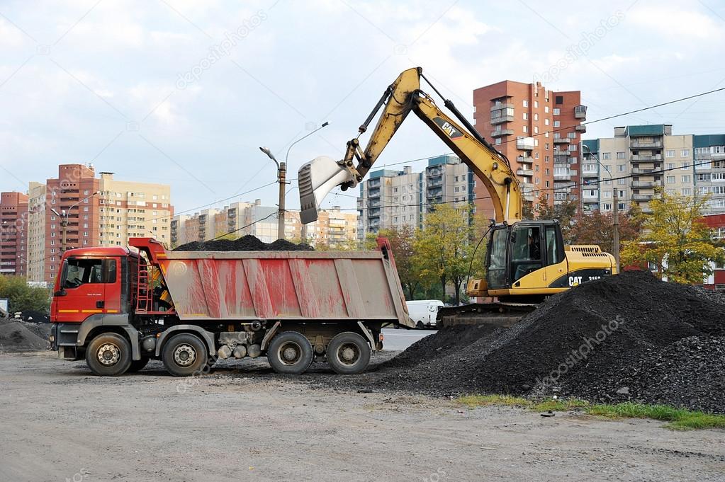 St. Petersburg, Russia - 19 SEPTEMBER: yellow excavator loads ib