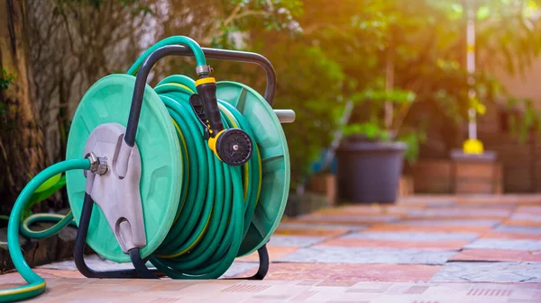 Old Water Hose Roll Nozzle Tile Floor Home Gardening Area — Stock Photo, Image