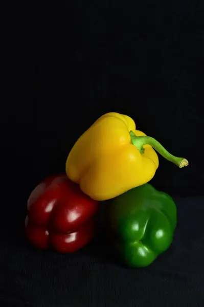 Big Peppers Three Colors Black Background — Stock Photo, Image