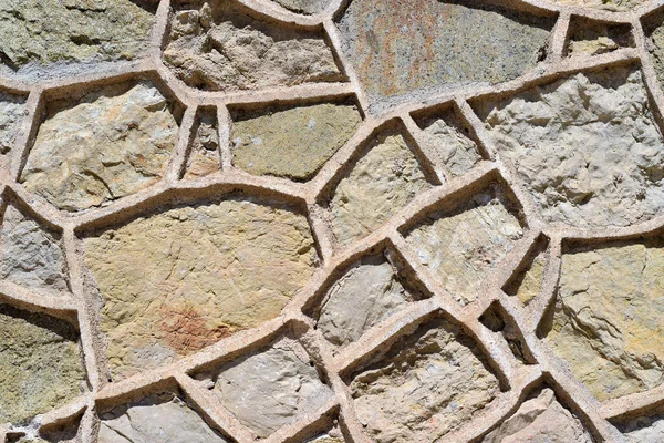 不均一な形状の石壁の背景 — ストック写真