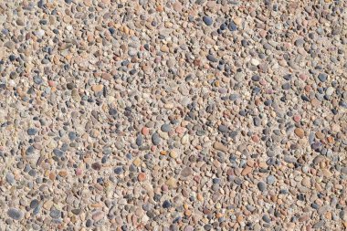Arka plan, küçük taşlarla, çeşitli renk tonlarıyla. Uzayı kopyala Üst görünüm.
