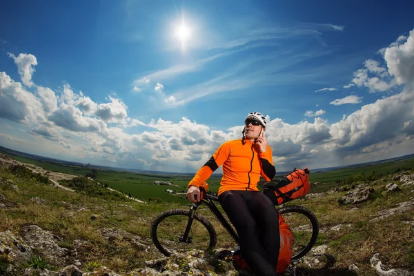 Young Male Cyclist Talking On Cell Phone — Stock Photo, Image