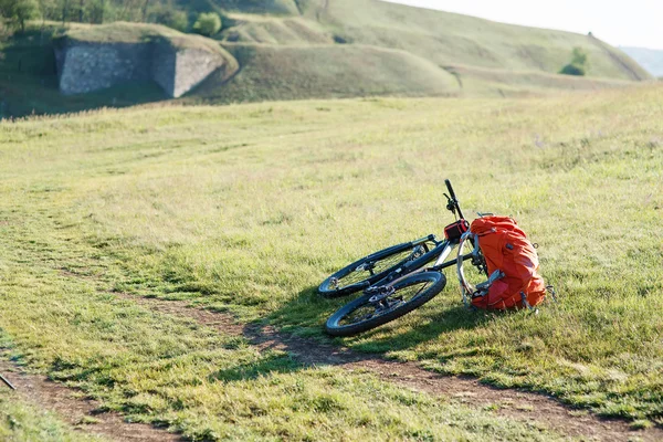 Bicycle with orange bags for travel