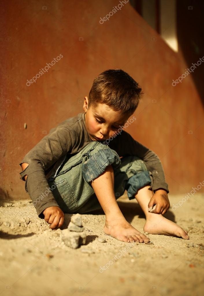 Alone sad child on a street Stock Photo by ©aleksey_rezin 79990088