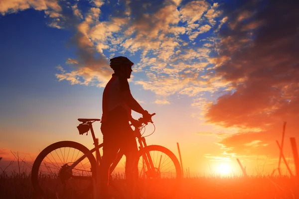 Mountain bicycle rider on the hill — Stock Photo, Image