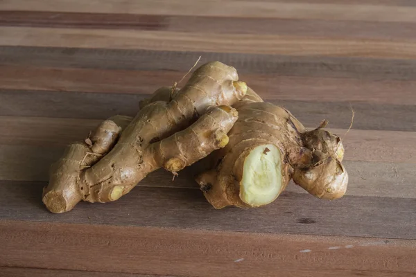 Ginger on a wooden table — Stock Photo, Image