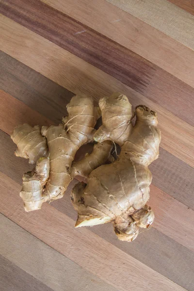 Ginger on a wooden table — Stock Photo, Image