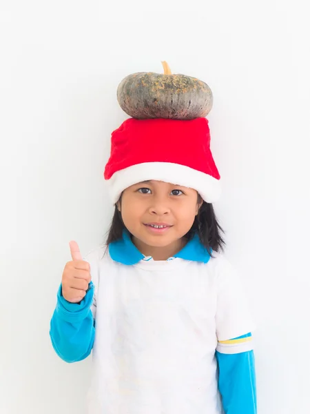 Asian girl pumpkin on his head and lifting finger. — Stock Photo, Image