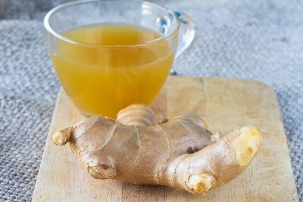 Ginger on wooden and ginger tea — Stock Photo, Image