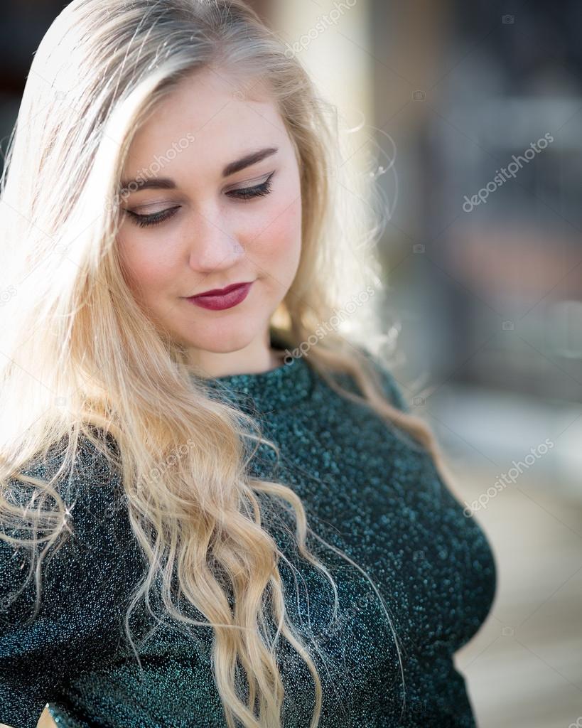 Blue Eyed Blond Teenage Girl With Lipstick And Green Tshirt