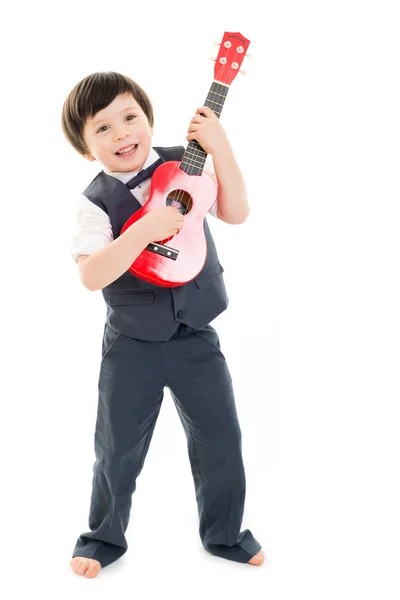 Chlapec hrát ukulele — Stock fotografie