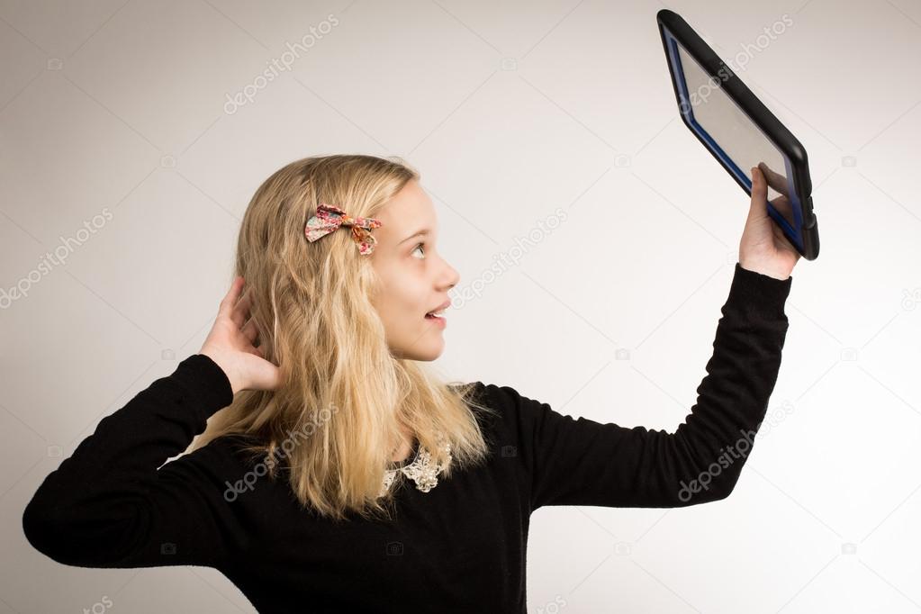 Teenage Girl Taking A Selfie On Her Tablet