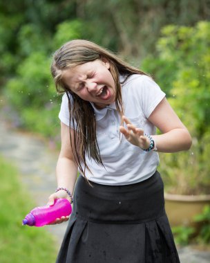 Girl Receiving Water In Her Face Looking Disgusted
