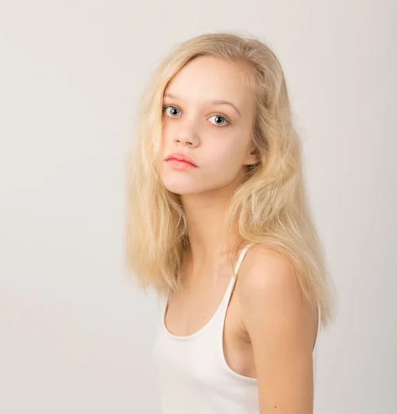 Beautiful Serious Blond Teenage Girl In White Top — 图库照片