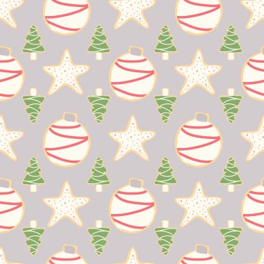 Noel ağaçları, yıldızlar ve gümüş bir arka planda süsler içeren buzlu Noel kurabiyeleri.