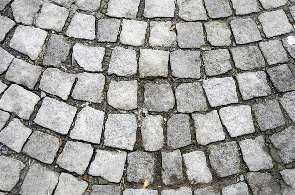 Old cobblestones road surface — Stock Photo, Image