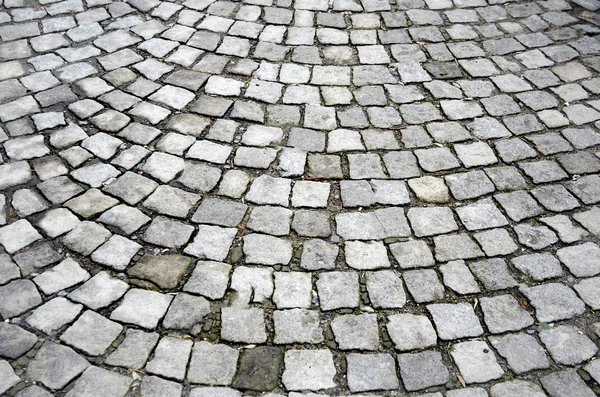 Eski cobblestones yol yüzeyi — Stok fotoğraf