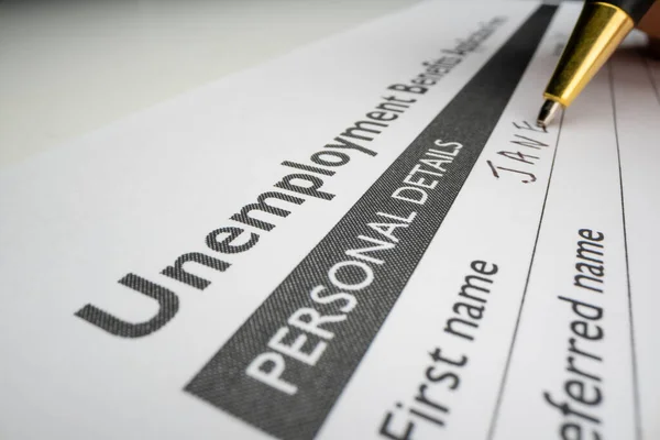 Completing unemployment benefits application form — Stock Photo, Image