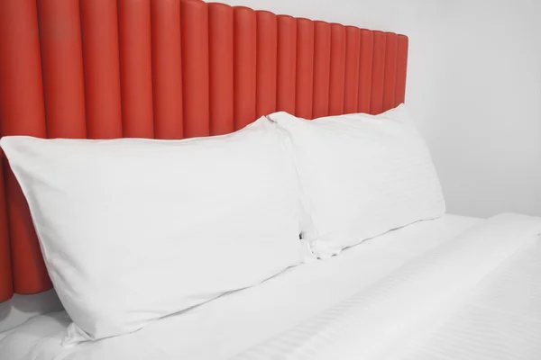 Bed with headboard and pillows — Stock Photo, Image