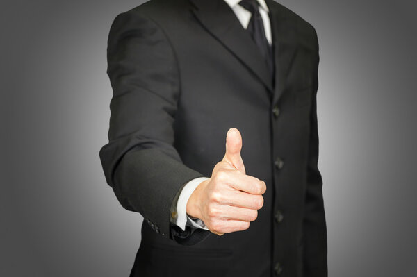 Businessman with thumbs up gesture